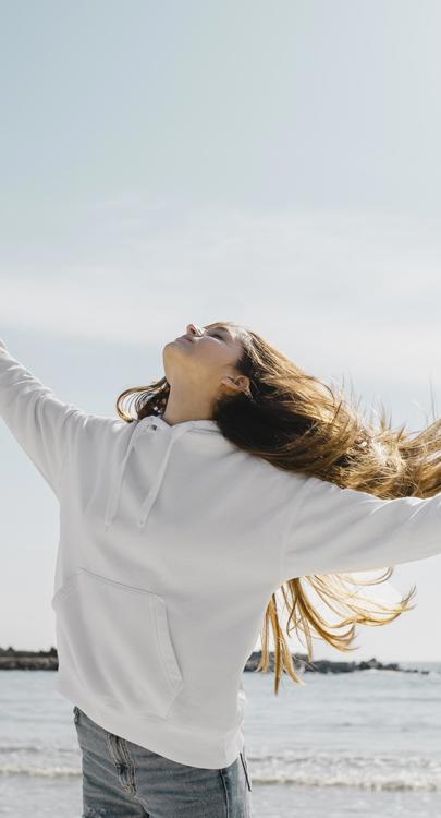 young-woman-enjoying-ocean-breeze.jpg